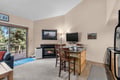 Step into this serene mountain retreat with vaulted ceilings, abundant natural light, and cozy fireplace. Enjoy morning coffee at the breakfast bar while taking in peaceful forest views from your private balcony.