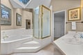 Upstairs Primary Bathroom Shower Indulge in your private spa-like bathroom with a deep soaking tub, separate glass shower, and elegant skylight above.