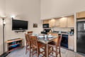 Your well-equipped kitchen invites you to prepare home-cooked meals while gathering around the granite breakfast bar. Light wood cabinetry and modern appliances make cooking convenient and enjoyable.