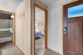 Step into your cozy home away from home. Hang your gear on the wooden hooks, peek into the inviting bedroom, and unwind in the ensuite with fresh towels waiting for you.