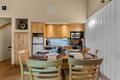 Gather around this inviting dining space, where you'll find everything you need to prepare and enjoy memorable meals together in your cozy mountain retreat.