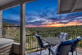 Watch the sunset paint the sky from your private balcony, where forest views stretch endlessly and evening relaxation awaits with comfortable seating for four.