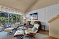 Sink into the iconic lounge chair or cozy sofa and unwind after your mountain adventures. Large windows frame serene forest views, while the open balcony invites fresh alpine air right into your retreat.