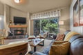 Curl up by the warm fireplace and let the stress melt away as you gaze out at the forest through your private balcony—your mountain escape awaits.