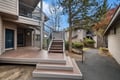 A quiet residential setting surrounded by mature trees and landscaping, providing a peaceful arrival experience at the property.