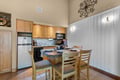 Your cozy kitchen and breakfast nook await, where warm wood tones and granite counters set the stage for mornings over coffee or quiet dinners together.
