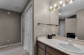 B unit private Bathroom Your spacious bathroom features a well-lit vanity with Hollywood-style bulbs, perfect for getting ready each morning.