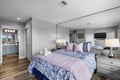 Settle into your serene bedroom suite with plush bedding, soft lighting, and an ensuite bathroom just steps away—your peaceful retreat awaits.