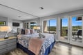 Step onto your private balcony and take in sweeping forest views framed by blue skies. Soft linens, gentle lighting, and direct outdoor access create a peaceful retreat where nature becomes part of your stay.